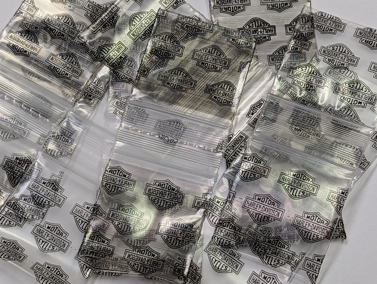 Resealable Harley Davidson Original Apple Bags, 1.25 x 1.25 inches, with Harley Davidson branding and clear packaging.