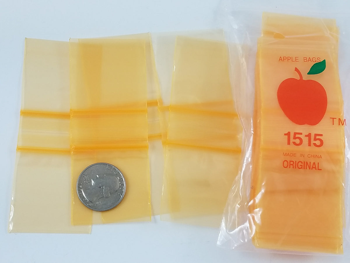 Orange 1.5x1.5-inch resealable bags from Original Apple Bags, perfect for storing small items or produce.