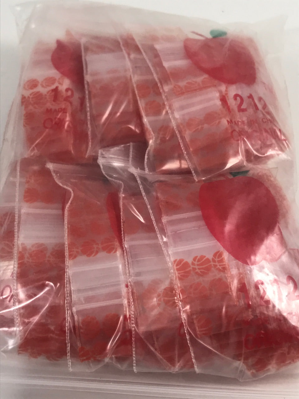 Resealable Original Apple Bags basketball design, 1/2 inch by 1/2 inch, ideal for snack storage and packaging.