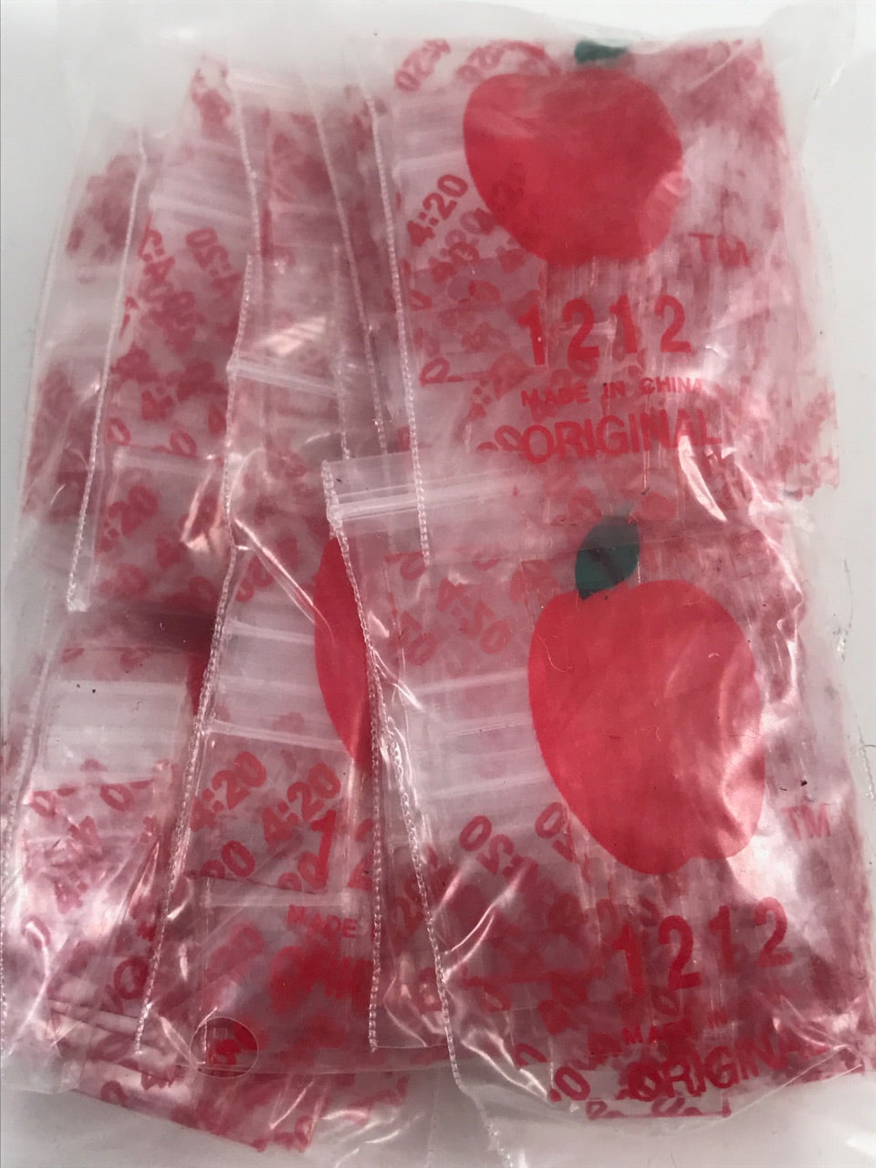 Resealable 1212 Original Apple Bags, 1/2 x 1/2 inches, suitable for storing small items or snacks.