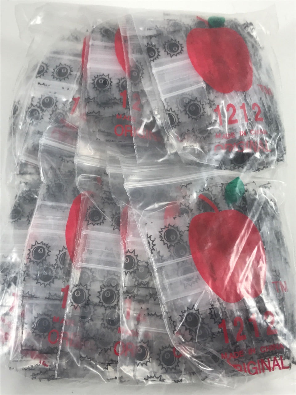 Set of eight resealable Original Apple Bags with 1/2 inch by 1/2 inch 8-ball design for secure storage.