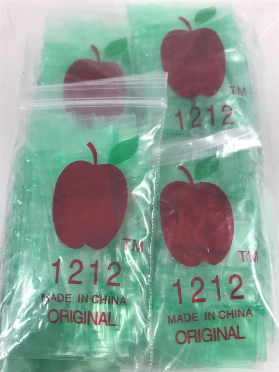 Green 1212 Original Apple Bags resealable 1/2 inch by 1/2 inch bags for storage or packaging.
