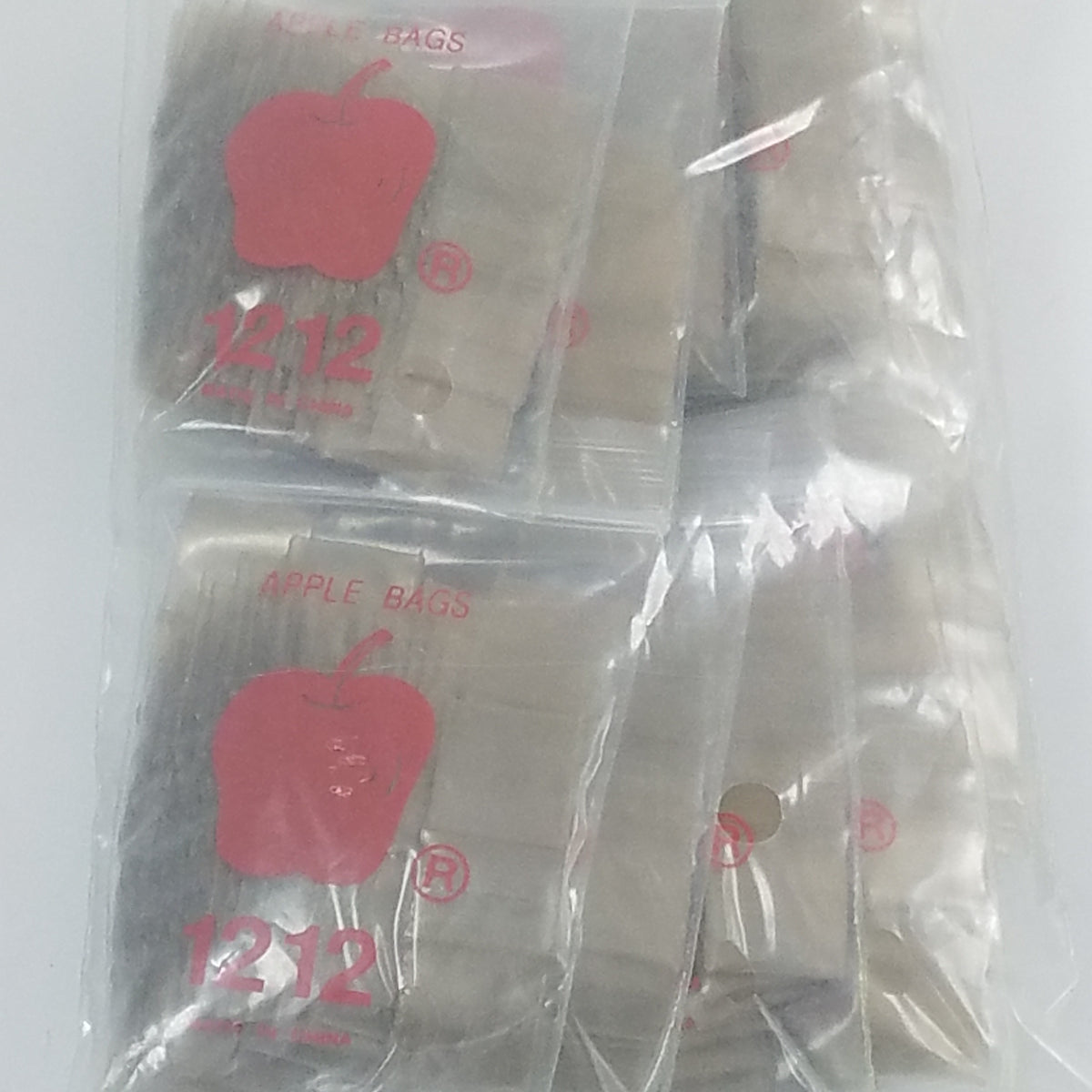 Original Apple Bags 1/2" x 1/2" gold resealable bags for secure storage and packaging.