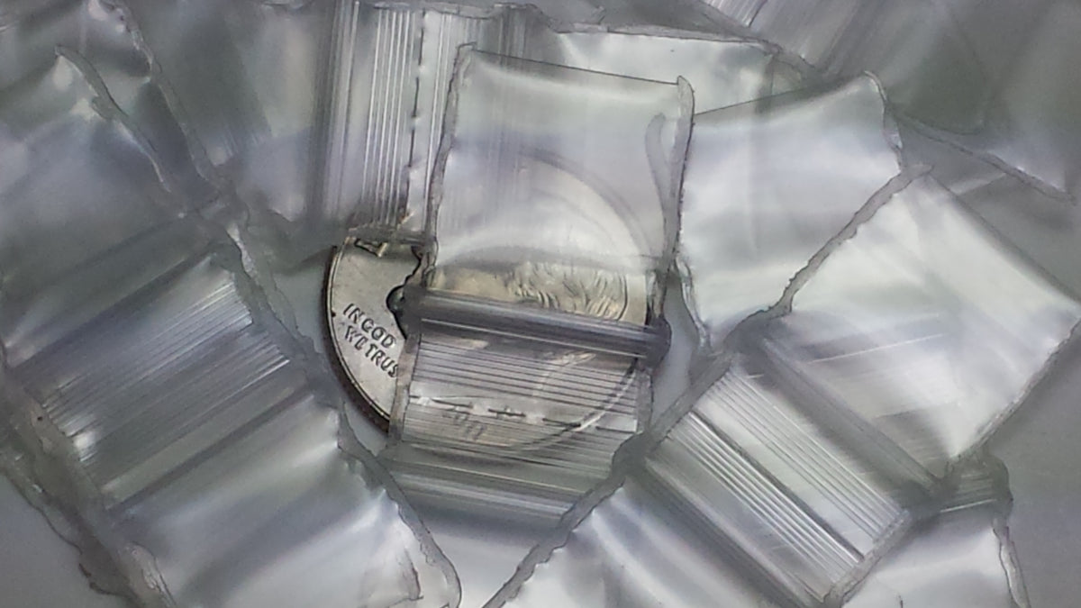 Clear 1/2 x 1/2-inch resealable bags from Original Apple Bags, perfect for storage and organization.