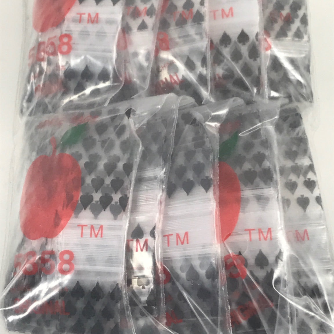 Resealable 5858 Original Apple Bags, 5/8 inch by 5/8 inch, designed for secure storage of small items or spices.
