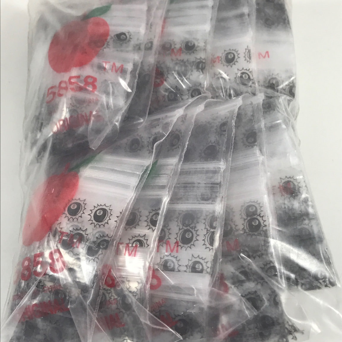 Resealable Original Apple Bags 5/8" x 5/8" with Eight Ball design, ideal for storing small items or collectibles.
