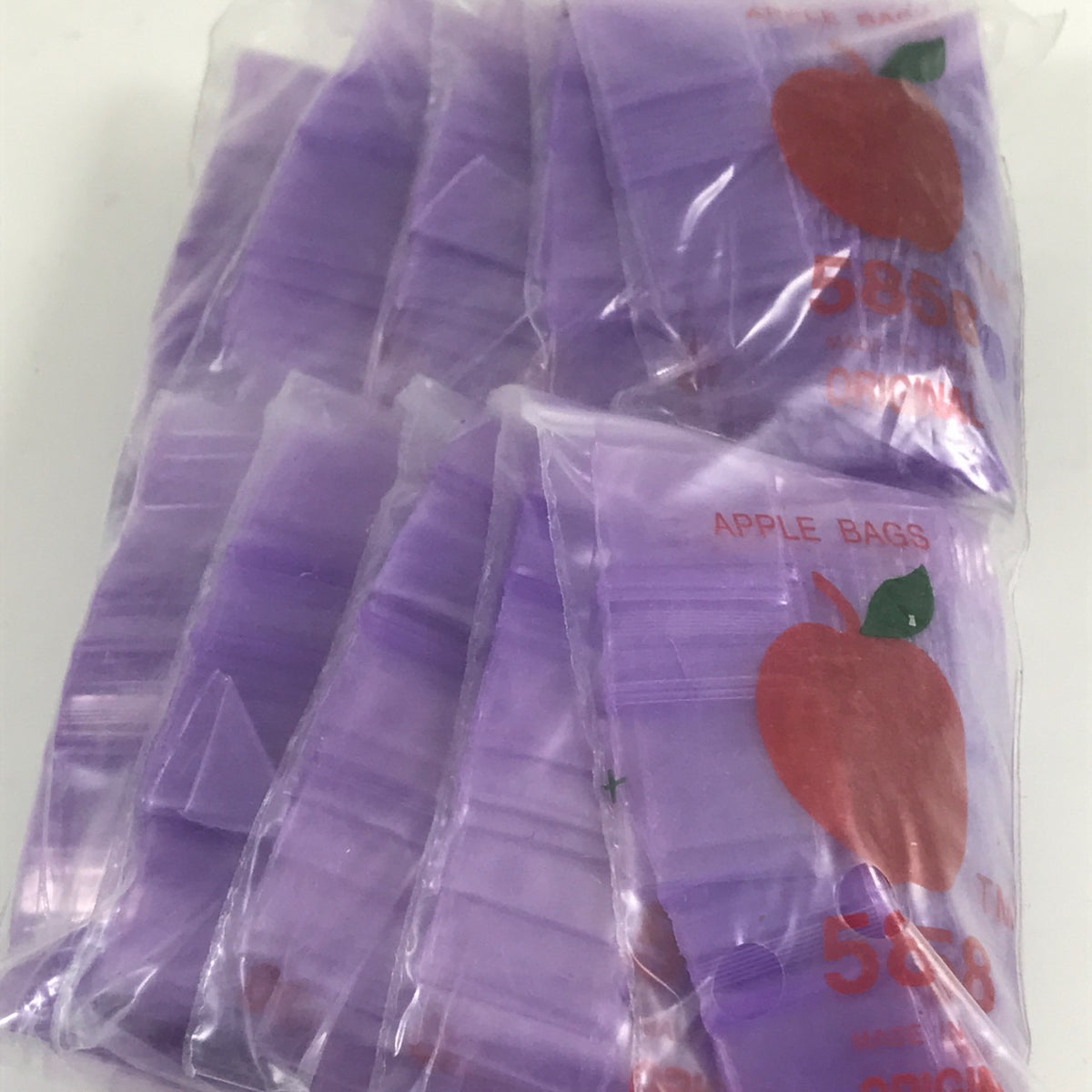 Purple 5/8" x 5/8" resealable bags from Original Apple Bags, ideal for storage and organization.