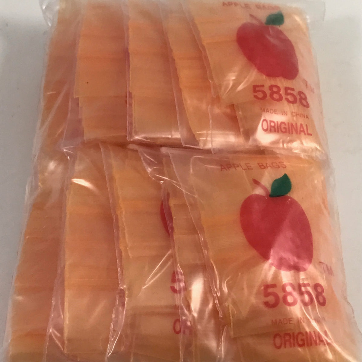 Orange 5858 Original Apple Bags resealable bags, 5/8 inch by 5/8 inch, made by Original Apple Bags, shown in the image.