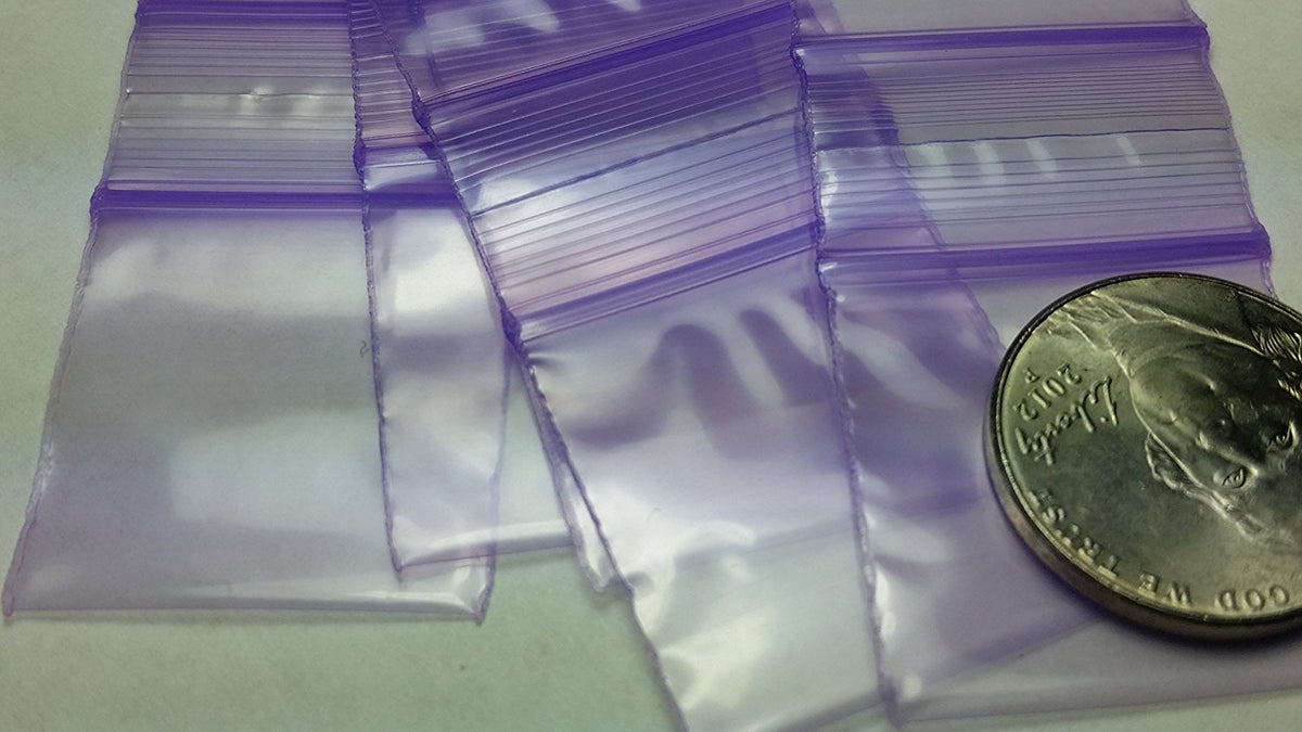 Purple 1x1.5-inch resealable bags by Original Apple Bags, ideal for packaging small items or gifts.