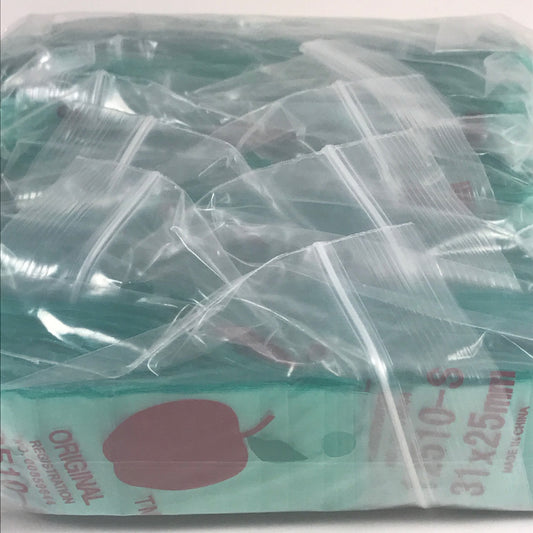 Green Original Apple Bags resealable bags, 1.25" x 1", designed for storing small items or produce.