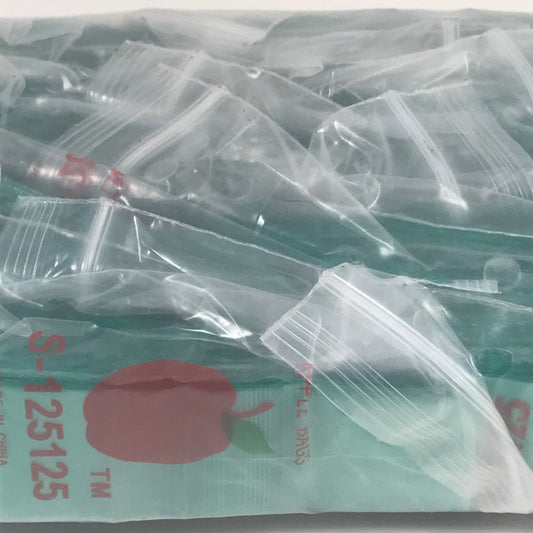 Green resealable bags from Original Apple Bags, 1.25 x 1.25 inches, perfect for storing small items or snacks.