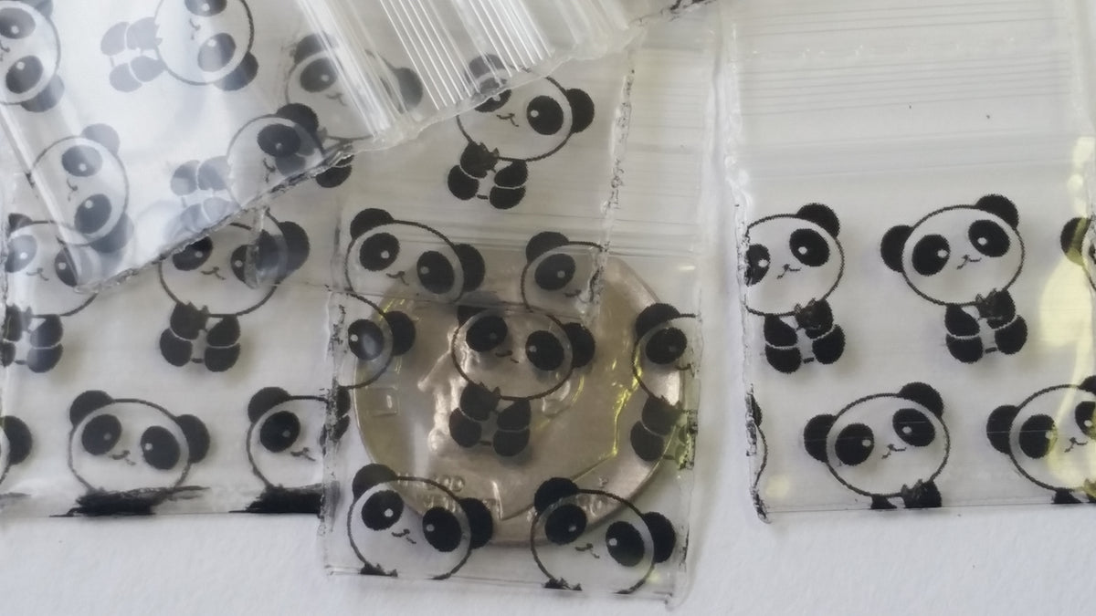 Resealable Original Apple Bags with panda design, 3/4 inch by 3/4 inch, perfect for storing small items.
