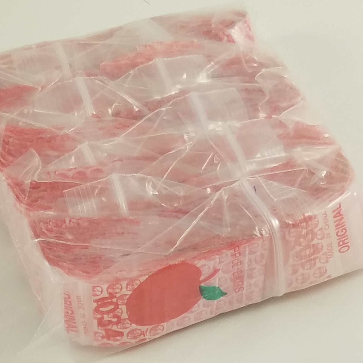 Red Dog Original Apple Bags, resealable 1" x 3/4" bags, perfect for storing small items or snacks.