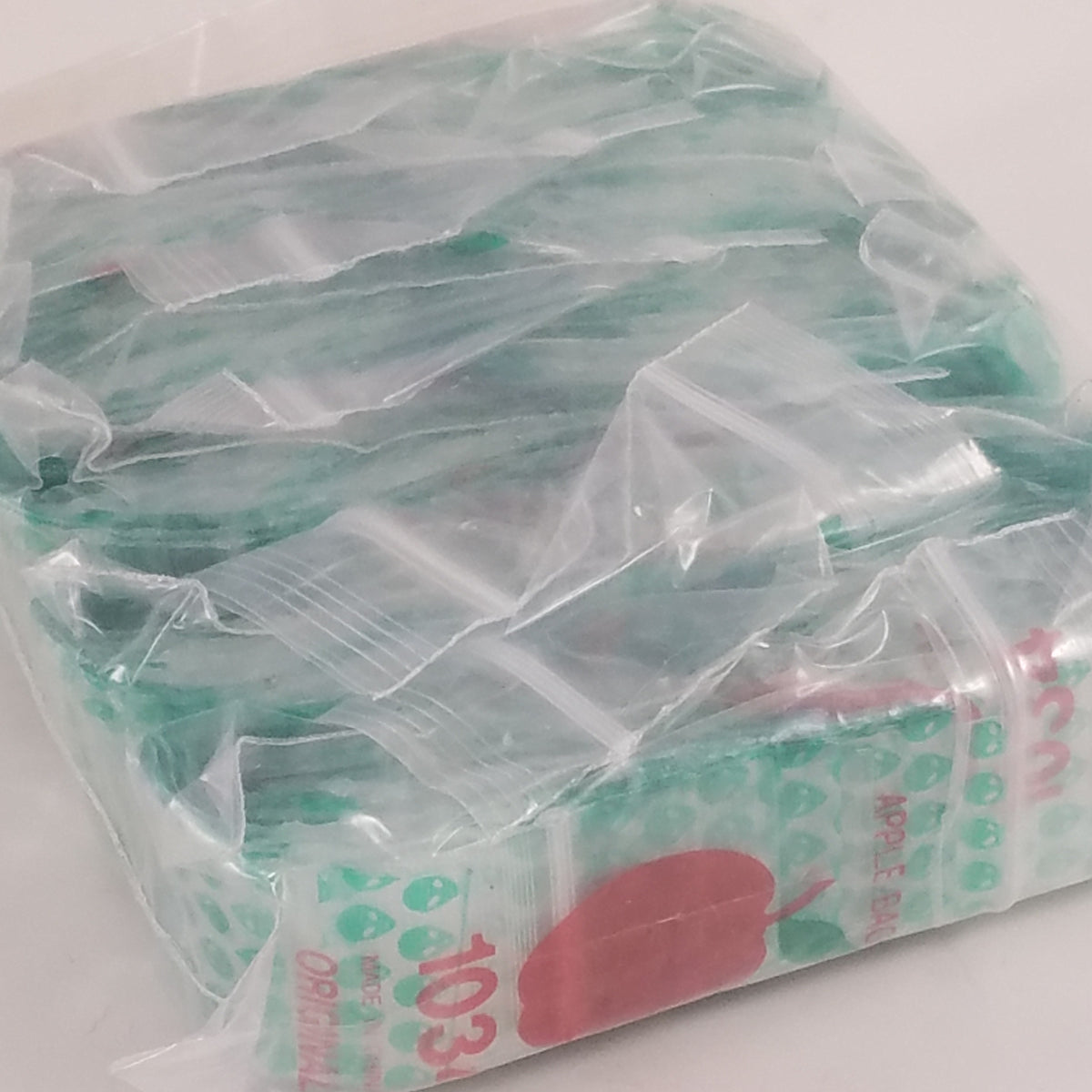 Green Alien Original Apple Bags, resealable 1" x 3/4" bags, designed for secure storage and packaging.