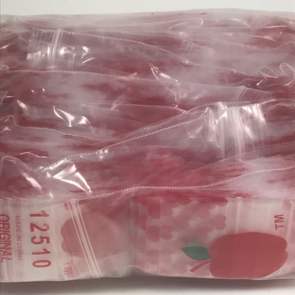 Original Apple Bags resealable bags with heart design, 1.25" x 1" size, ideal for packaging small items or gifts.