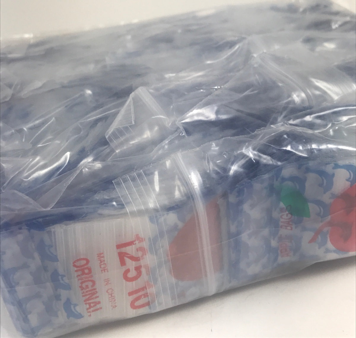 Original Apple Bags resealable bags with dolphin design, 1.25" x 1", perfect for storage and organization.