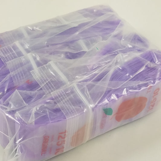 Purple resealable bags from Original Apple Bags, 1.25" x 1", ideal for packaging small items or snacks.