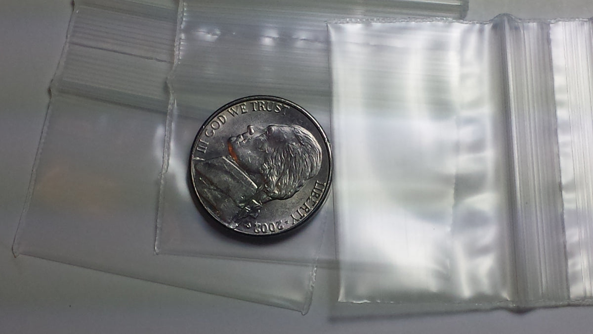 Clear resealable Apple Bags by Original Apple Bags, 1.75" x 1", perfect for packaging small items or snacks.