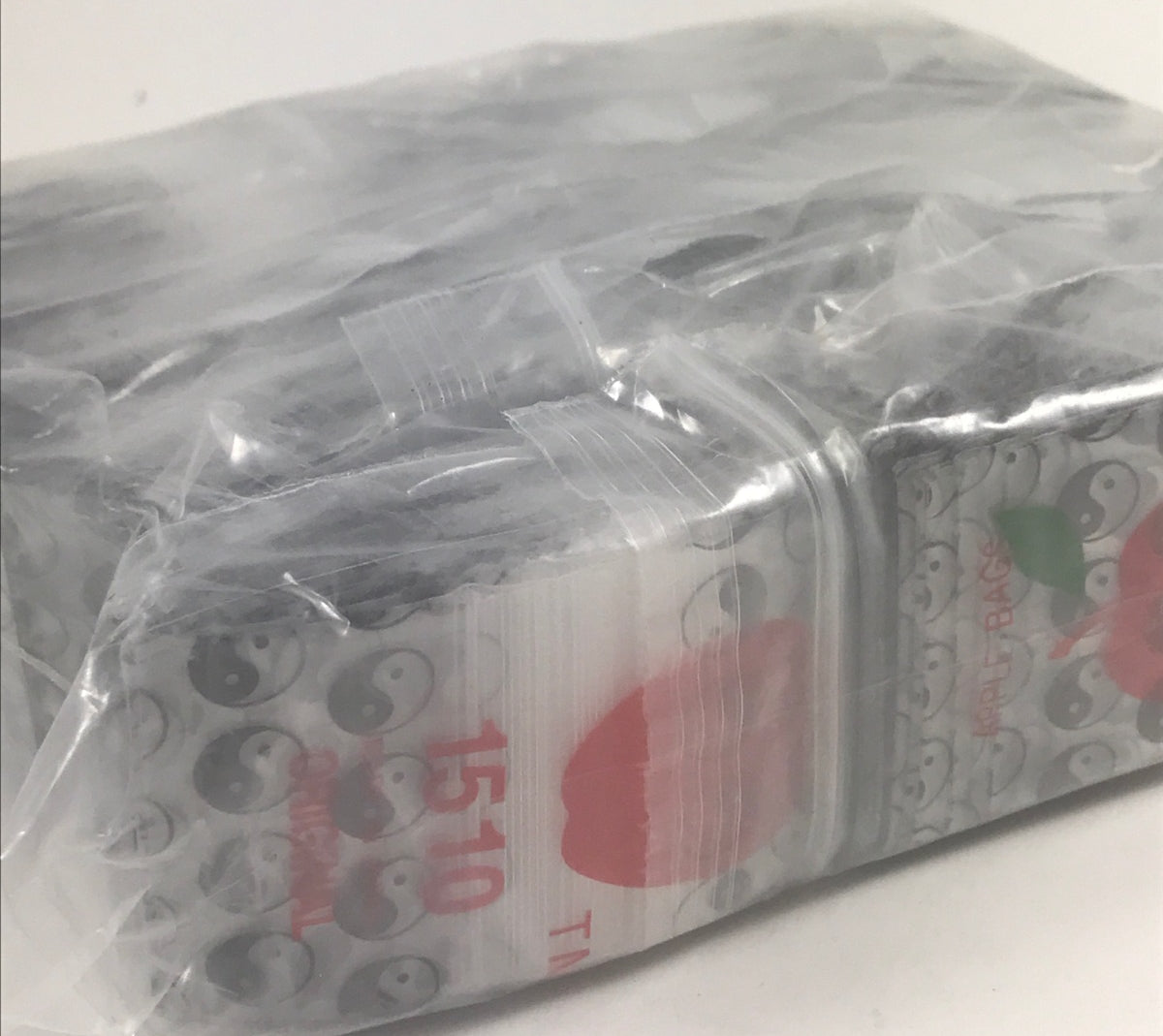 Original Apple Bags resealable bags with TaiJi/Yin Yang design, 1.5" x 1" size, ideal for storage and organization.