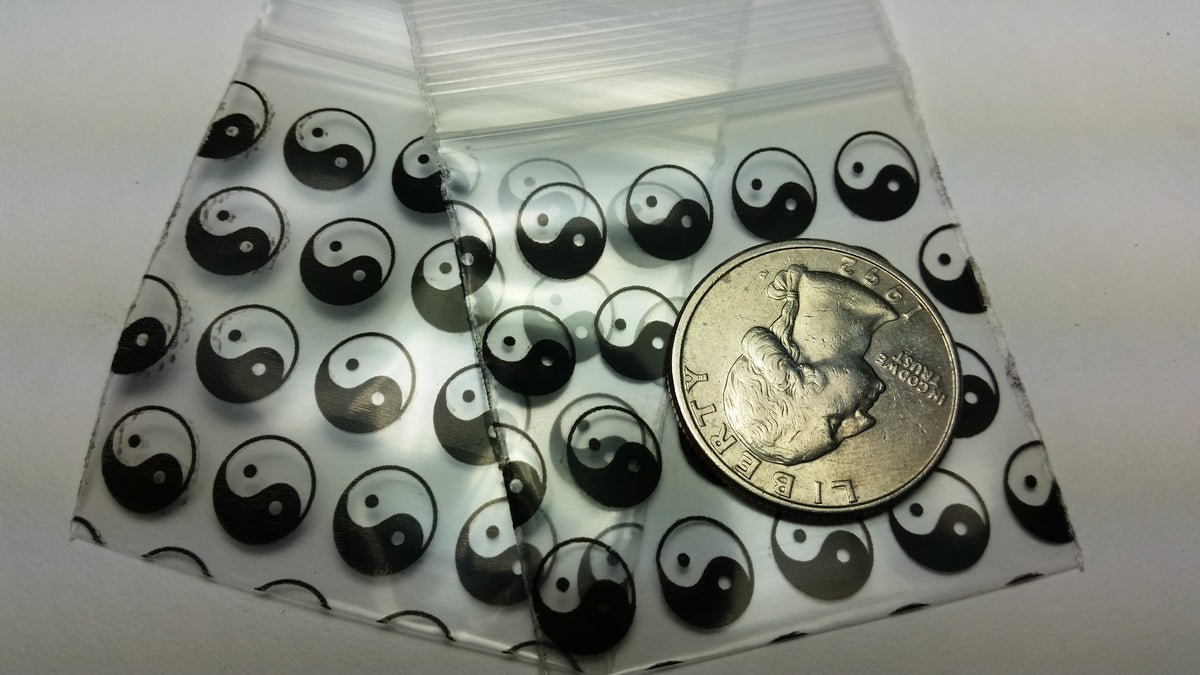 Original Apple Bags resealable bags with Taiji/Yin Yang design, 1.75x1.75 inches, featuring black and white symbols.