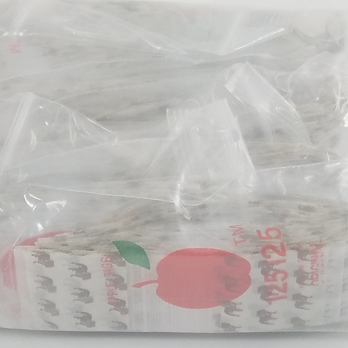 Original Apple Bags resealable bags, 1.25 x 1.25 inches, durable plastic packaging for small items or snacks.