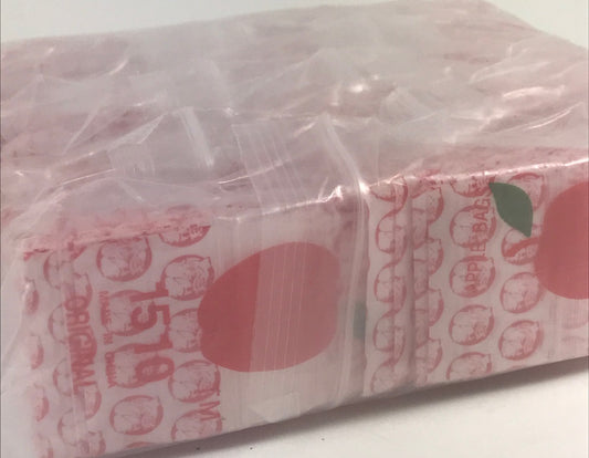 Red dog-themed resealable Apple Bags, 1.5" x 1", from Original Apple Bags, featuring colorful, fun packaging for small items.