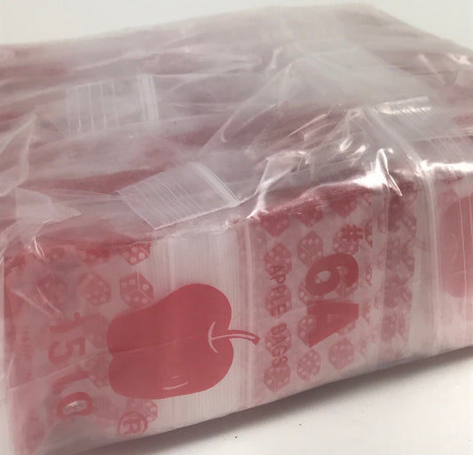 Red dice resealable bags from Original Apple Bags, 1.5" x 1", ideal for packaging small items or collectibles.