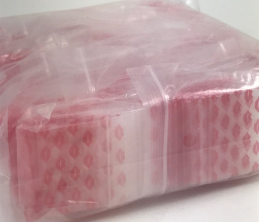 Resealable Original Apple Bags with 1.5" x 1" size and lip closure, ideal for packaging small items or candies.