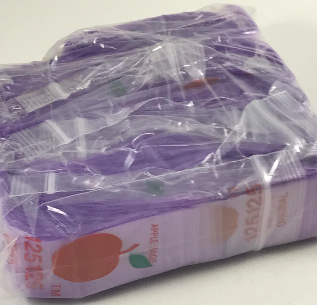 Purple Original Apple Bags resealable bags, 1.25 x 1.25 inches, designed for secure storage and packaging.