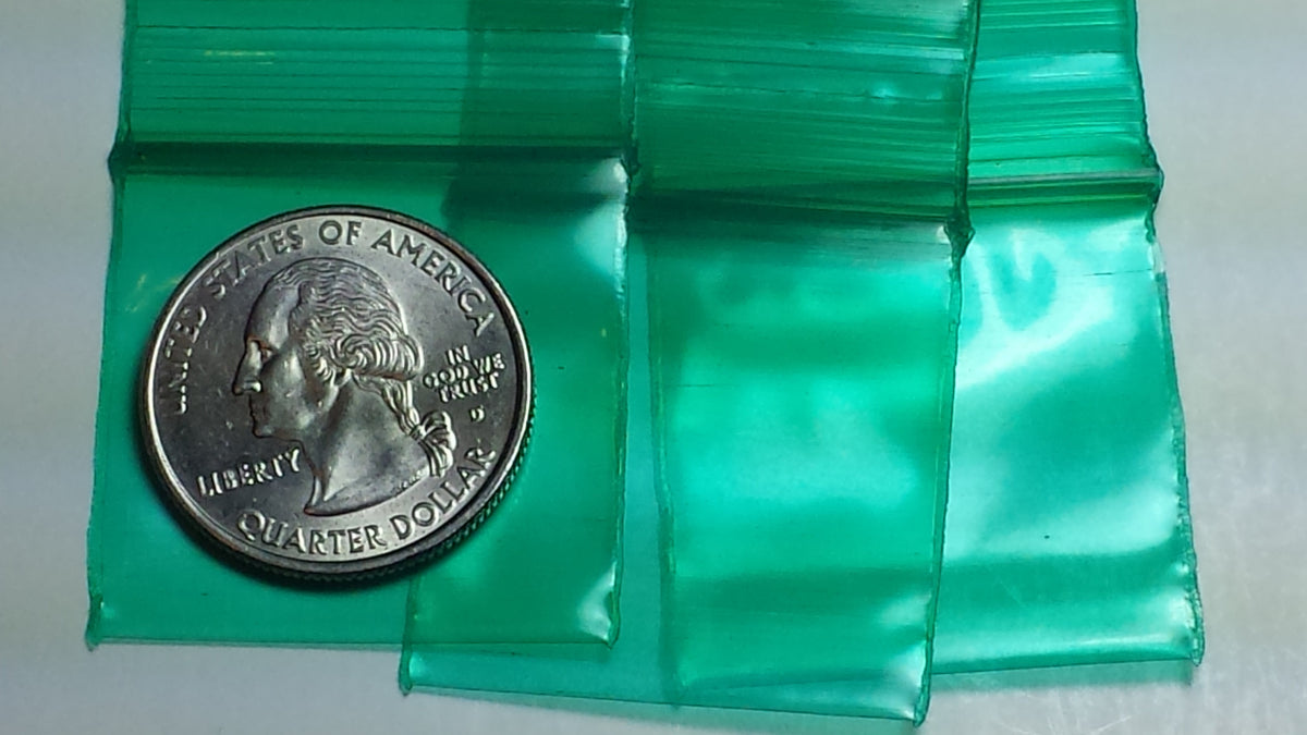 Green resealable bags from Original Apple Bags, 1.25 x 1.25 inches, designed for secure storage and organization.
