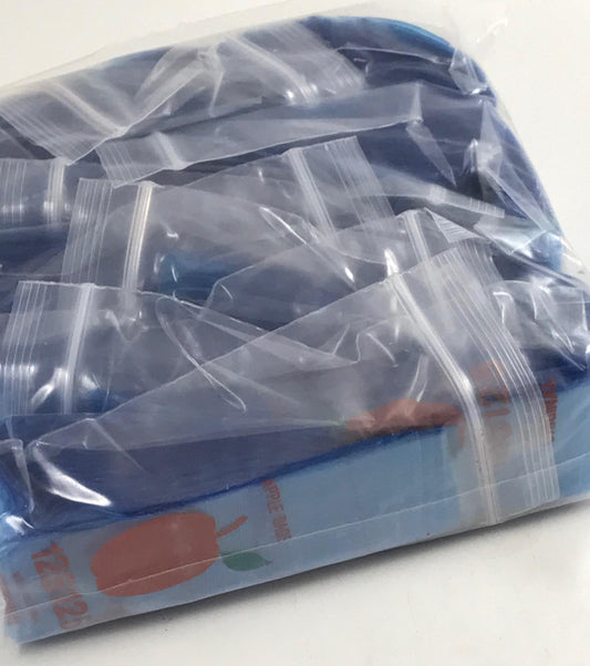 Blue 1.25"x1.25" resealable bags from Original Apple Bags, made of durable material, perfect for storage and organization.