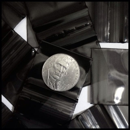 Original Apple Bags resealable black bags, 1.25 x 1.25 inches, perfect for small storage or packaging.