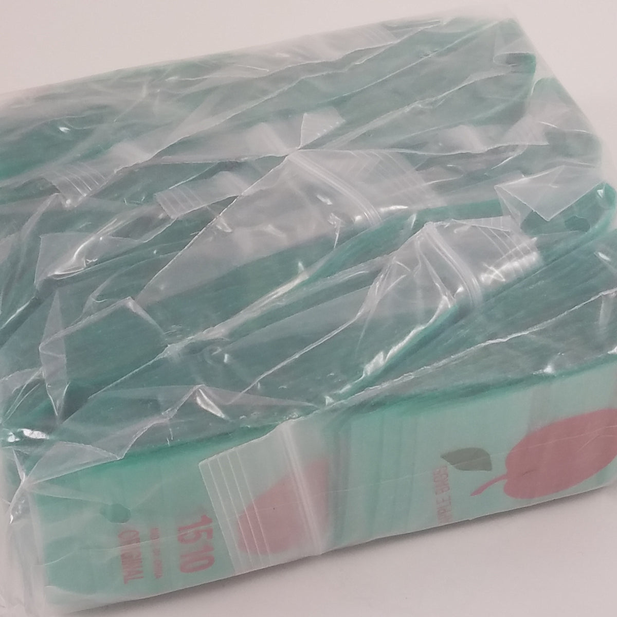 Green 1.5 x 1-inch Original Apple Bags resealable bags, ideal for packaging small items or snacks.