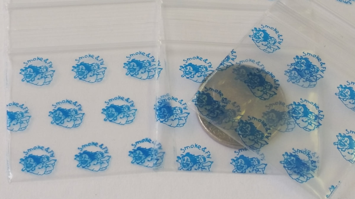 Original Apple Bags resealable bags in smoke and fly colors, measuring 1.5 x 1.25 inches, ideal for storage and packaging.