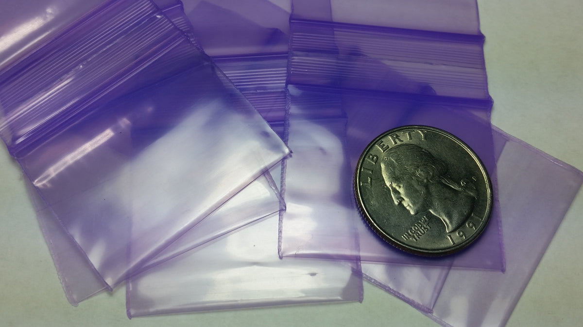 Purple Original Apple Bags resealable bags, 1.5" x 1.25", with a clear view of the purple color and resealable closure.