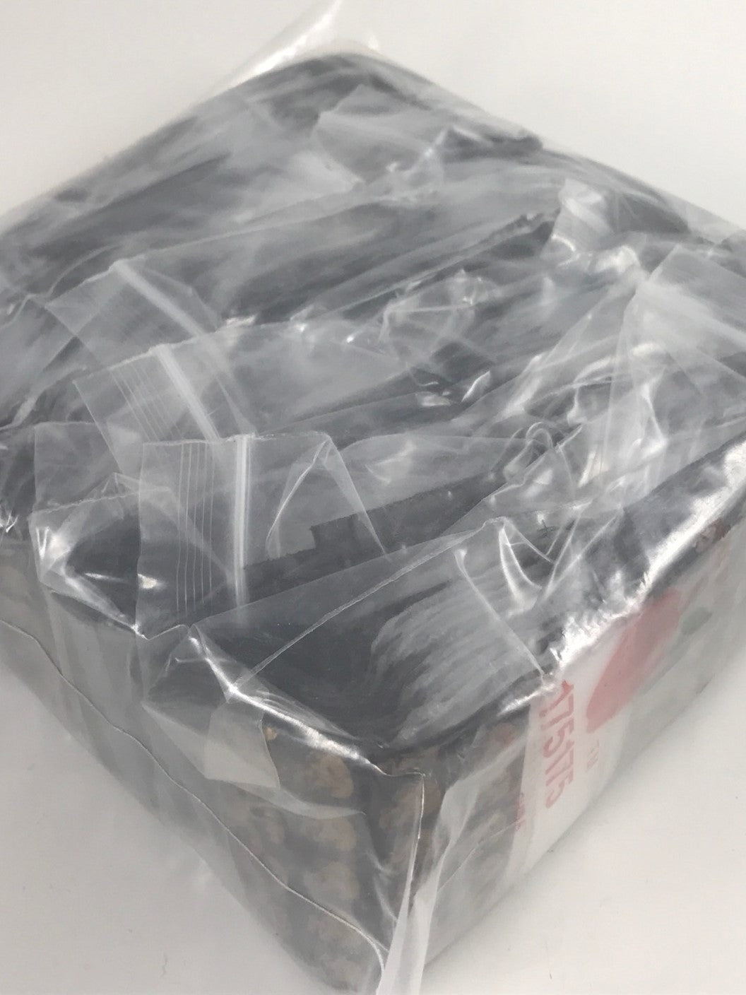 Original Apple Bags resealable bags with gold skull design, 1.75 x 1.75 inches, ideal for packaging or storage.