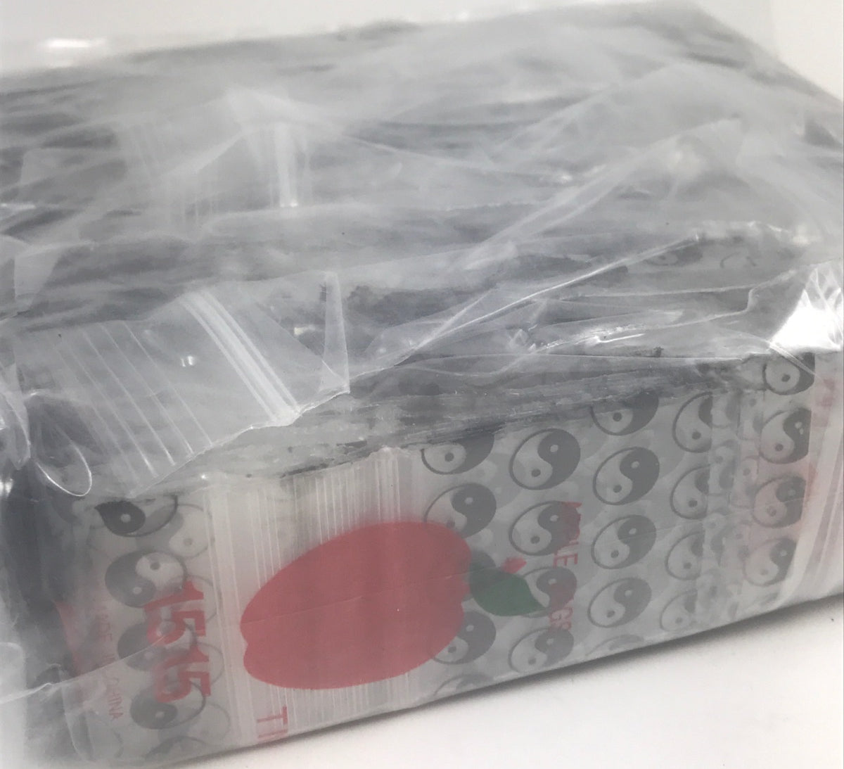 Resealable Original Apple Bags with Taiji/Yin Yang design, 1.5 x 1.5 inches, ideal for storing small items.