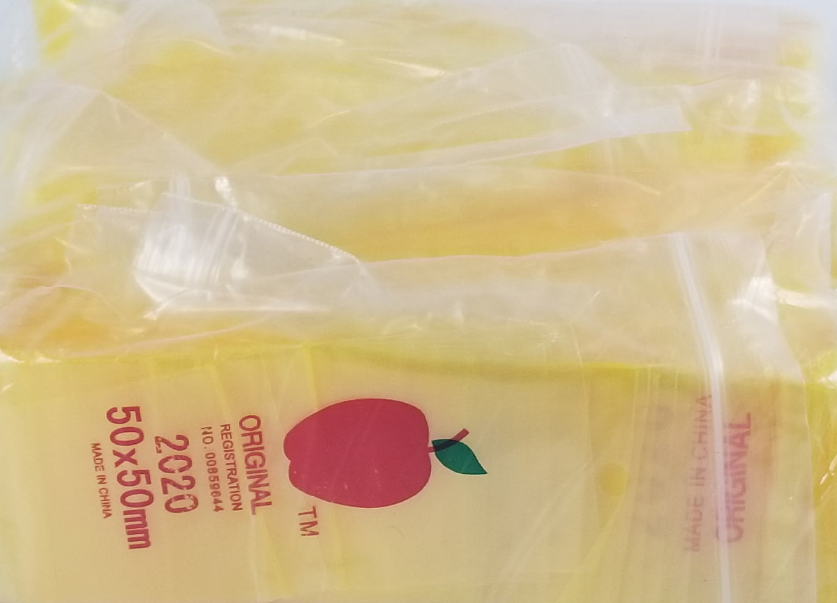Yellow 2020 Original Apple Bags resealable 2x2-inch storage bags, ideal for organizing small items.