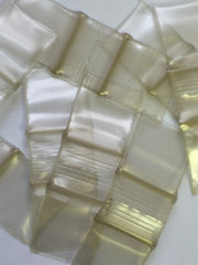 Gold SIZE 1212 Original Apple Bags from The Baggie Store, 1/2" x 1/2" dimensions, shown with sealed edges and transparent material.