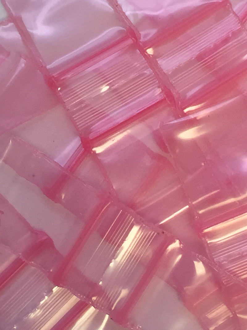 Pink Size 1212 Original Apple Bags from The Baggie Store, 1/2" x 1/2" dimensions, showing sealed pink plastic bags on a white background.