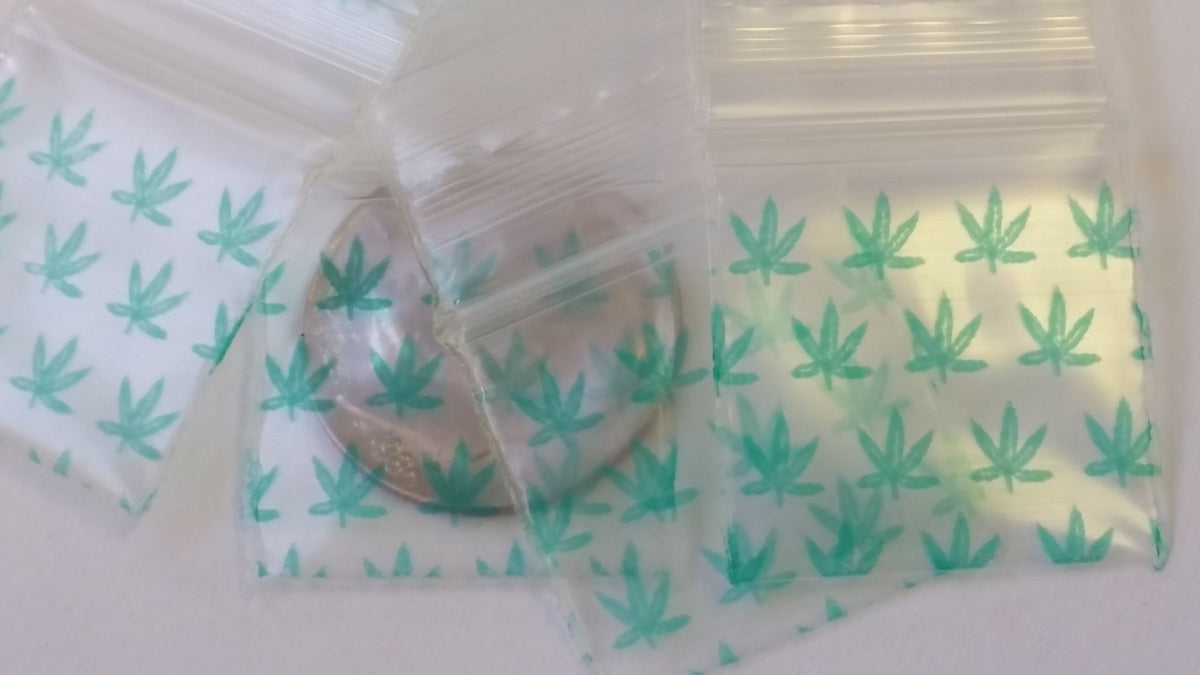 Original Apple Bags resealable bags with leaf design, 3/4 inch by 3/4 inch, ideal for packaging small items or crafts.