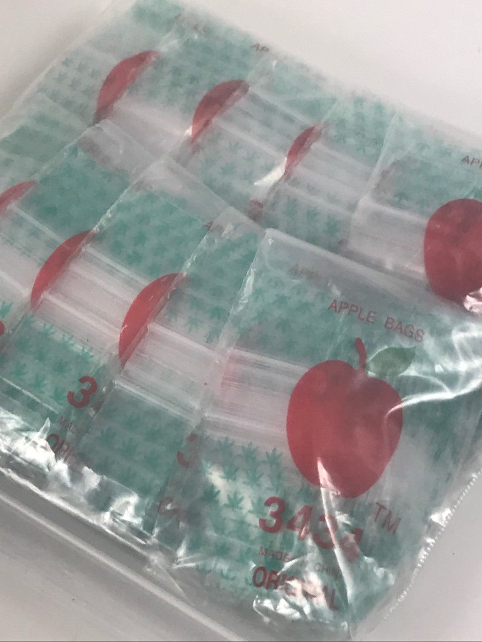 Resealable Original Apple Bags in leaf design, 3/4 inch by 3/4 inch, ideal for storing small items or crafts.