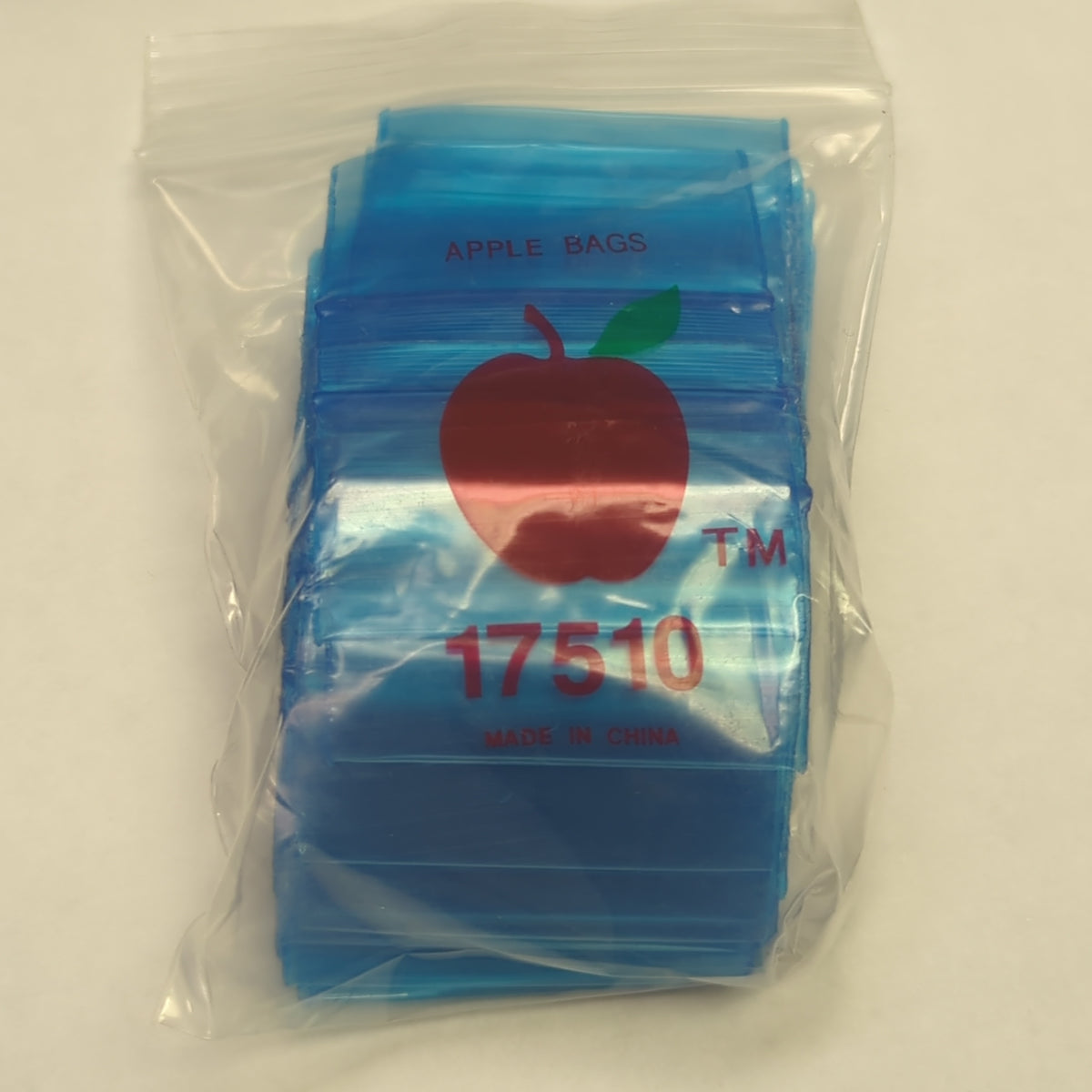 Blue resealable bags from Original Apple Bags, 1.75" x 1", ideal for organizing small items or packaging.