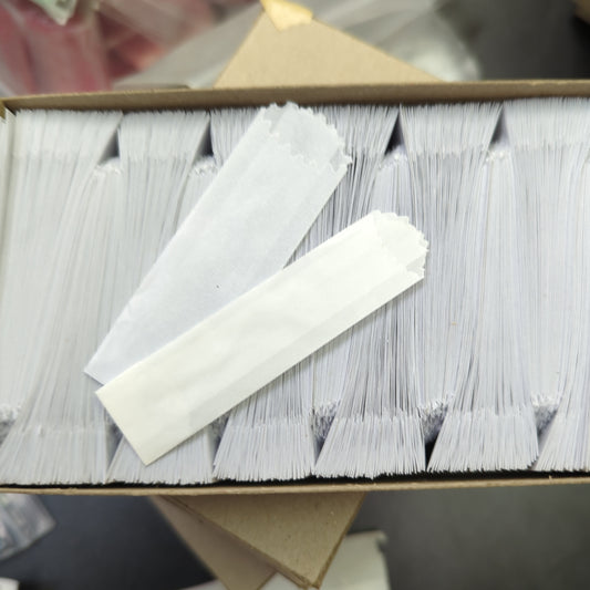 Gray vellum glassine stamp wax paper envelope bags from Stamp Collectors moisture resistant wax bags collection, showing sealed envelopes.