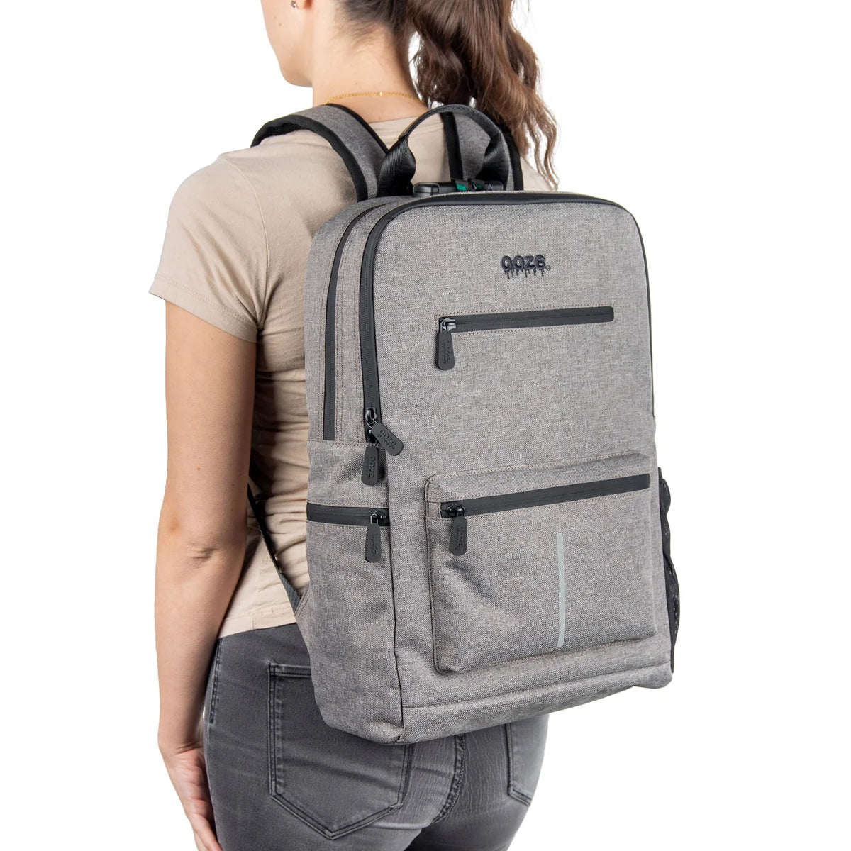 Ooze Traveler Classic smoke gray smell proof backpack with multiple compartments and padded straps for discreet carrying.