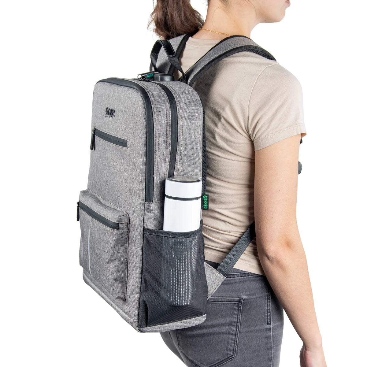 Ooze Traveler Classic smell-proof backpack in smoke gray with multiple compartments and padded straps for comfortable carrying.