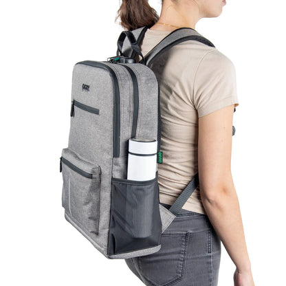 Ooze Traveler Classic smell-proof backpack in smoke gray with multiple compartments and padded straps for comfortable carrying.