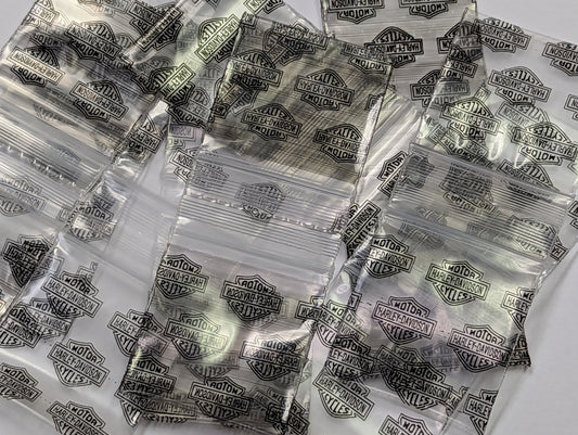 Resealable Harley Davidson Original Apple Bags, 1.25 x 1.25 inches, with Harley Davidson branding and clear packaging.