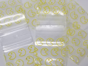 Original Apple Bags yellow Pacman-sized 1.5" x 1.5" bags, colorful packaging for storing small items or snacks.