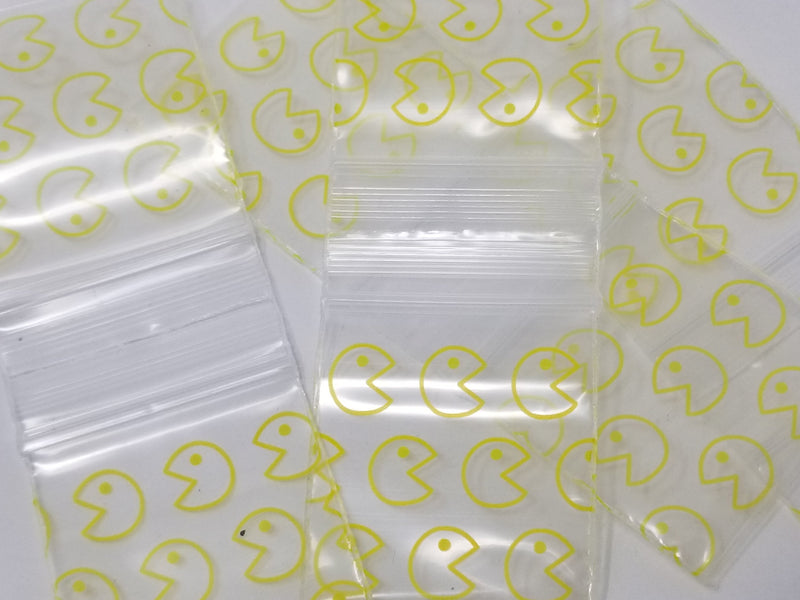 Original Apple Bags yellow Pacman-sized 1.5" x 1.5" bags, colorful packaging for storing small items or snacks.